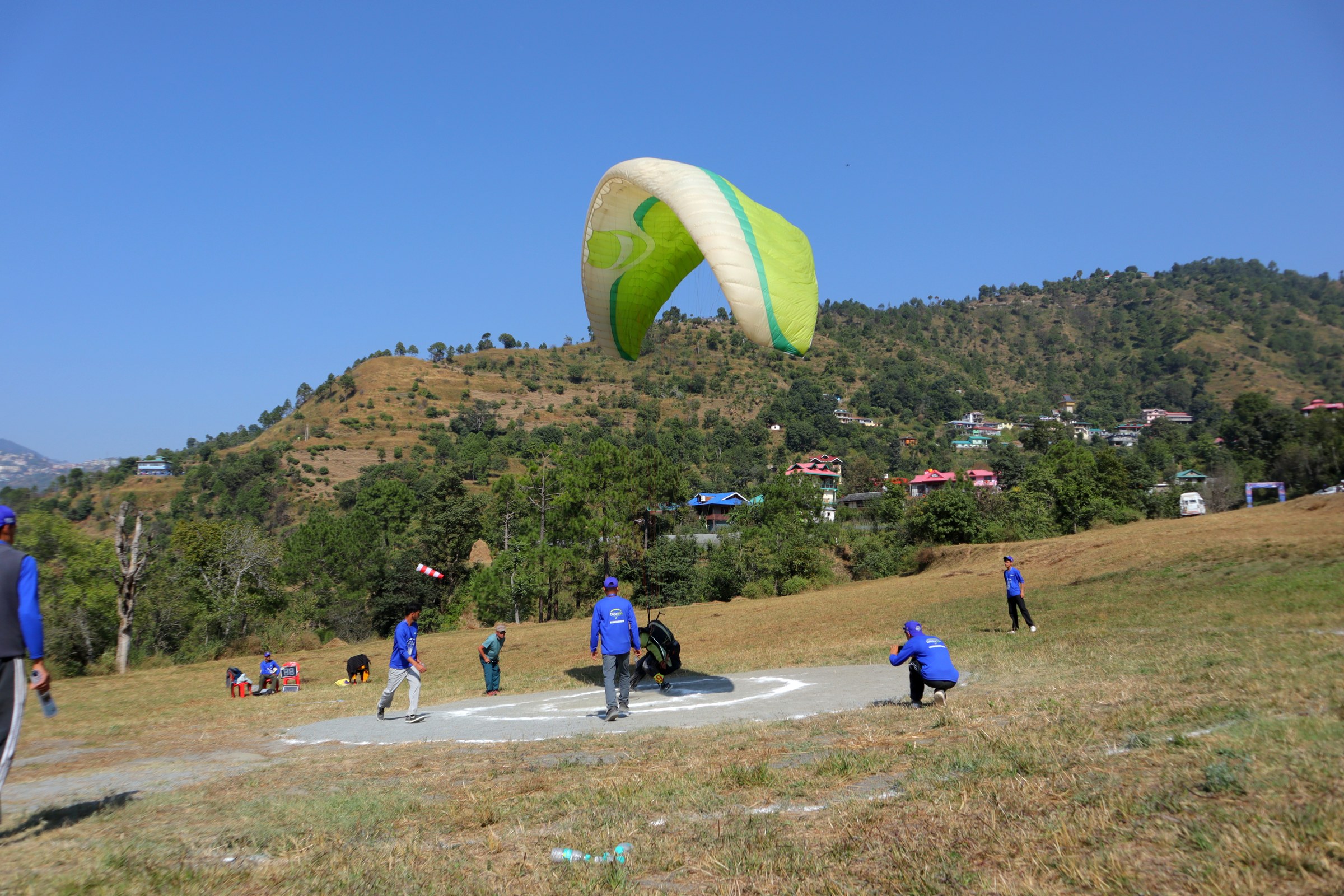 Tandem paragliding over Himalayan valley at The Glide Inn Shimla